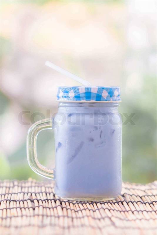 Thai milk ice tea on wooden, stock photo