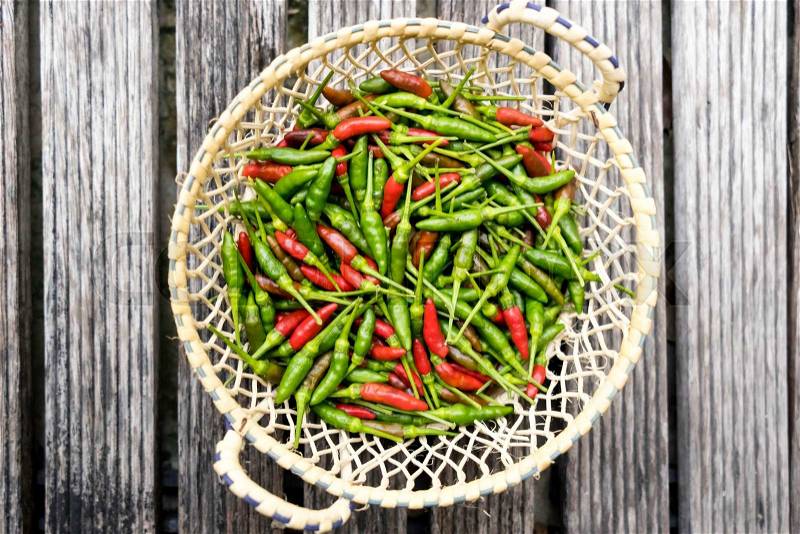 Red and green chili pepper in the besket, stock photo