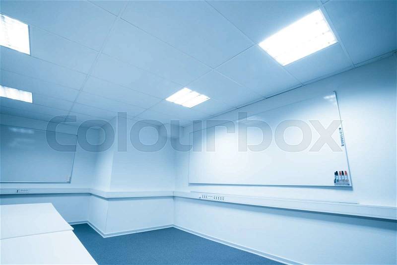 Meeting room with a large whiteboard in blue tone, stock photo