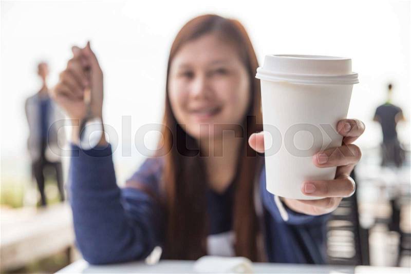 Woman hold cup of coffee and drink coffee, stock photo