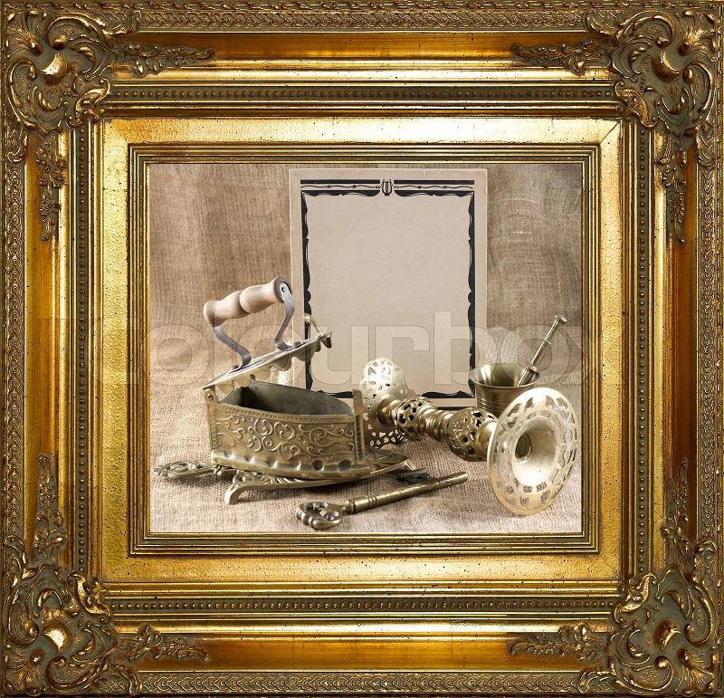 Vintage background with old things in golden frame, stock photo
