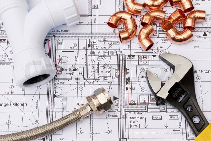 Plumbing Components Arranged On House Plans, stock photo