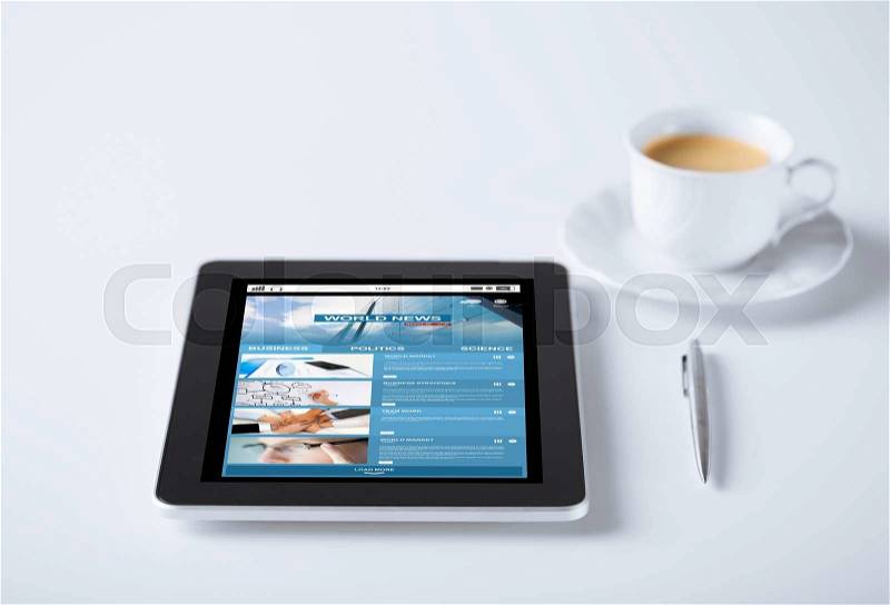 Business, mass media, information and technology concept - tablet pc computer with world news web page on screen and cup of coffee, stock photo