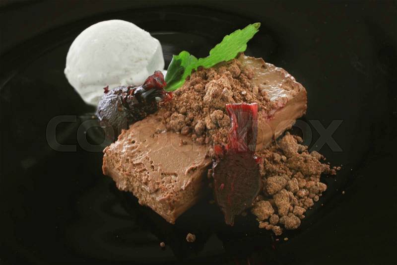 Plated sweet chocolate dessert with ice cream and beetroot, stock photo