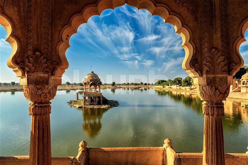 Indian landmark Gadi Sagar - artificial lake view through arch. Jaisalmer, Rajasthan, India, stock photo
