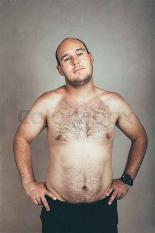 Portrait of a corpulent hairy shirtless man, stock photo