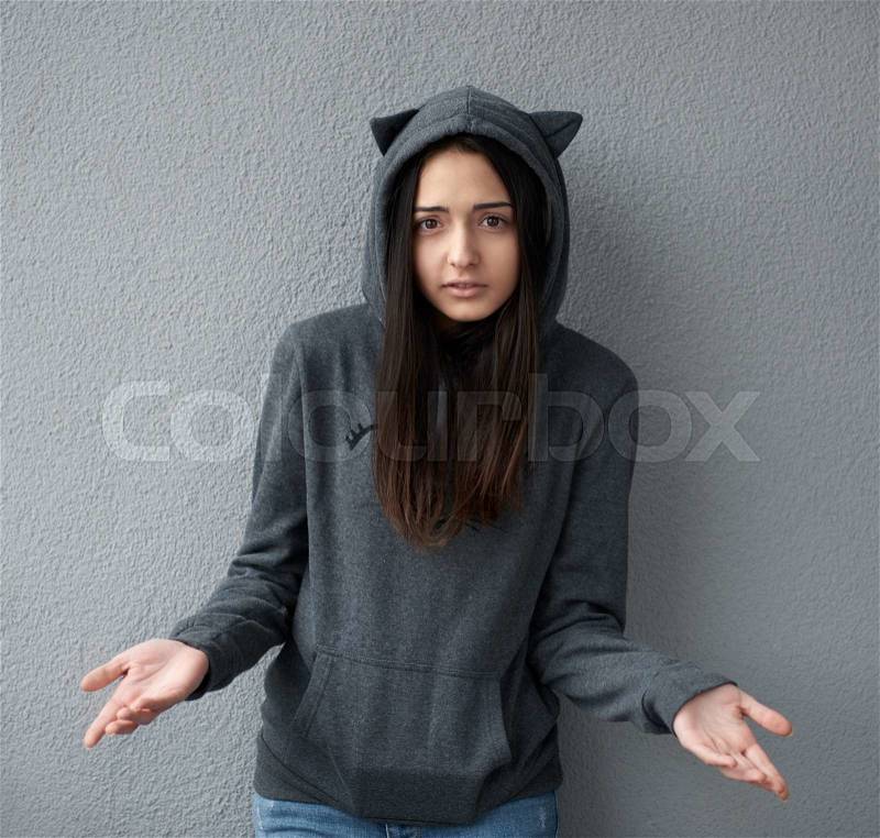 Pretty teenager girl asks a question, stock photo