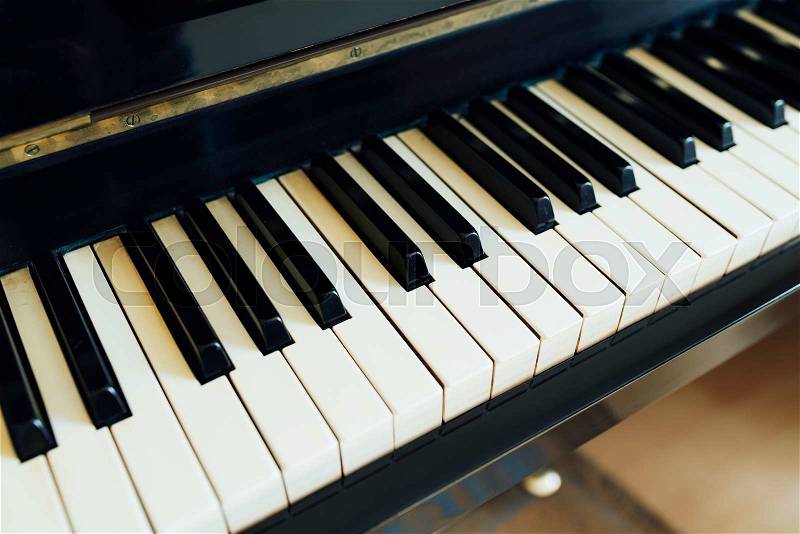 Black and white keys of the piano perspective side, stock photo