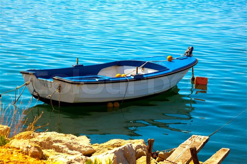 One fishing boat floating on the water, stock photo