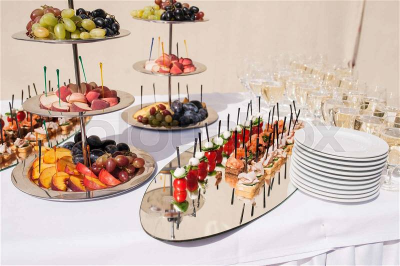 Sliced fruit for dessert on wedding ceremony, stock photo