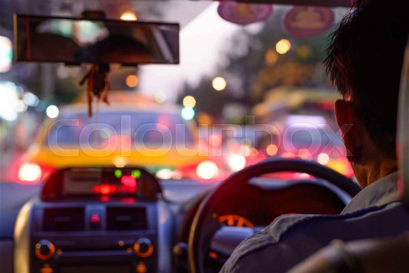 Blurred traffic jam on rush hour time, shooted from inside of car, stock photo