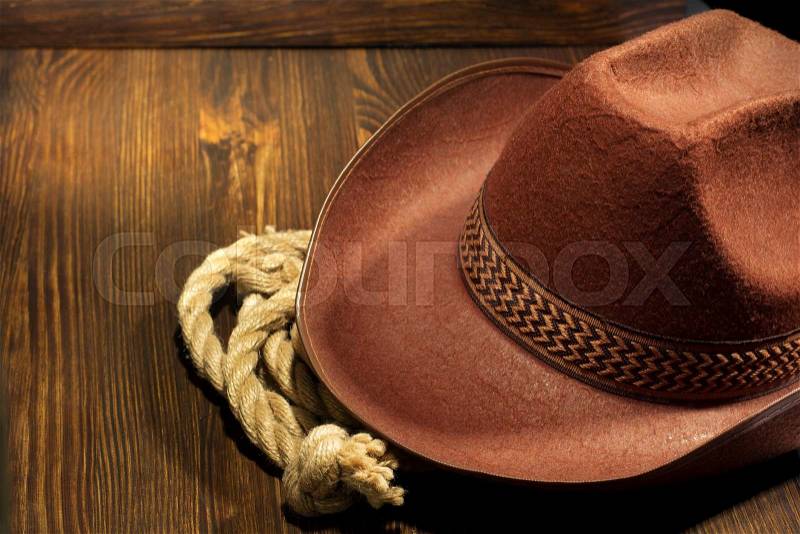 Cowboy hat on wooden background, stock photo