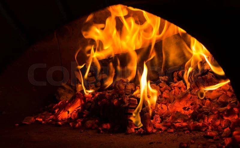 Fire in the oven. Traditional Pizza oven, stock photo