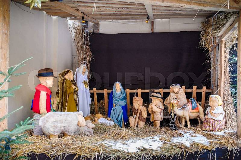 Christmas nativity scene of jesus birth in an old cottage nearby bethlehem with joseph, mary and shepherd, stock photo