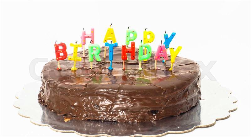 Chocolate happy birthday cake on silver tray towards white, stock photo