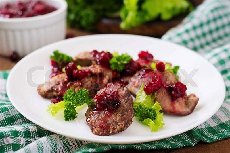 Chicken livers with cranberry sauce and lettuce, stock photo
