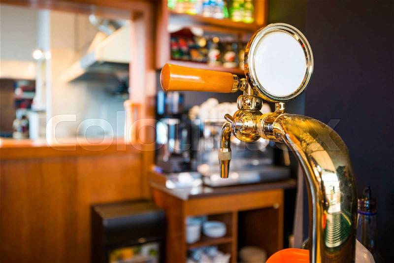 Golden Bar Beer Tap Closeup Photo. Pub Equipment, stock photo