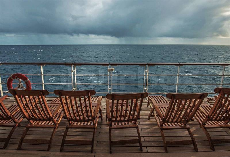 Cruise Ship Deck and the Stormy Horizon. Empty Cruise Ship Deck Because of Stormy Weather. , stock photo