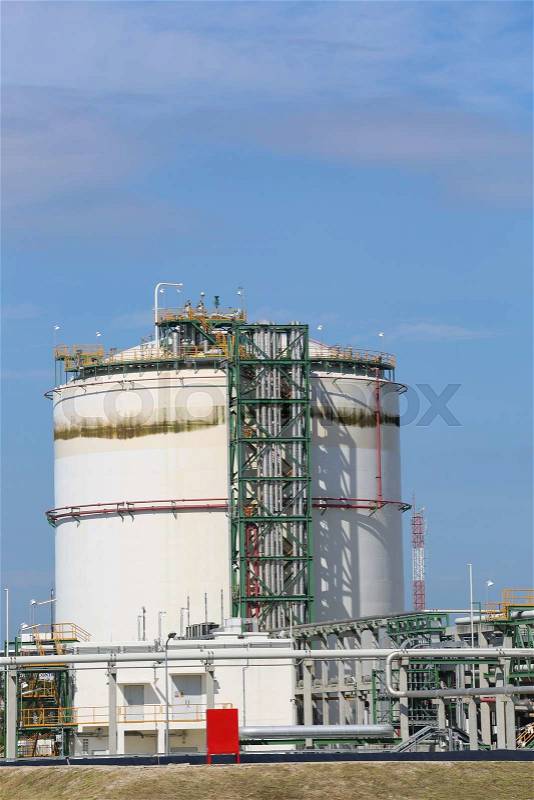 Chemical tank storage in refinery plant with blue sky, stock photo