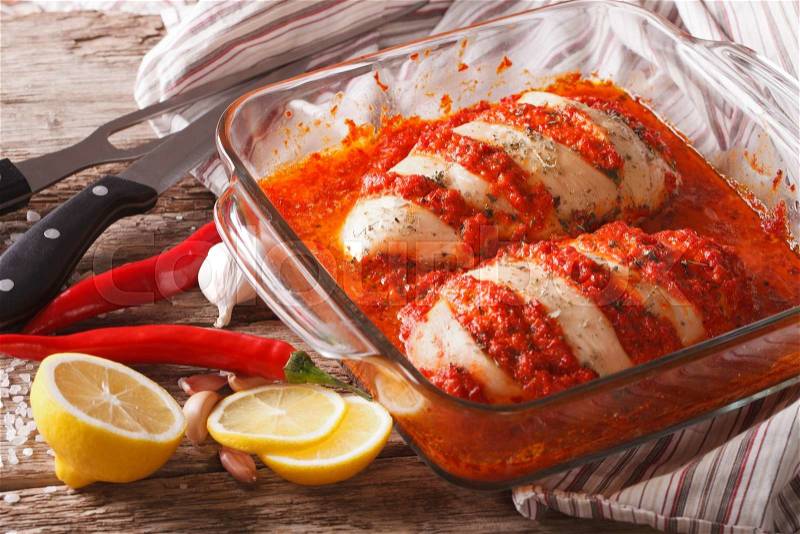 Portuguese food: spicy chicken piri piri close up in baking dish. horizontal , stock photo