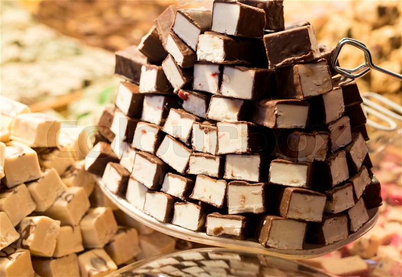 Sweet brown chocolate on tower at the market, stock photo