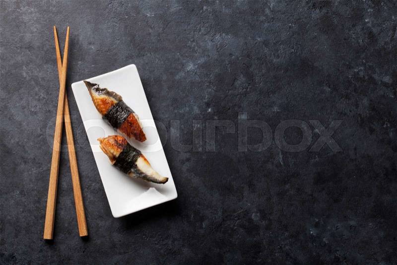 Set of eel sushi on stone table. Top view with copy space, stock photo