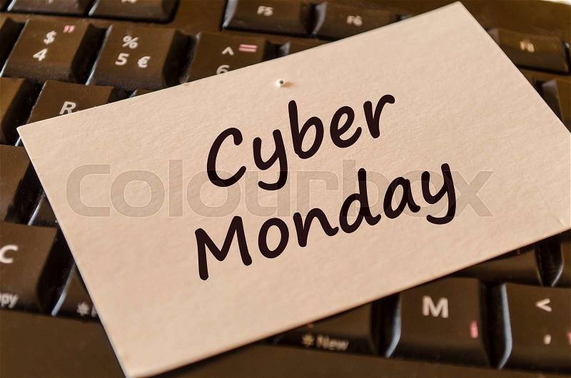 Computer Keyboard with white note and text cyber monday, stock photo