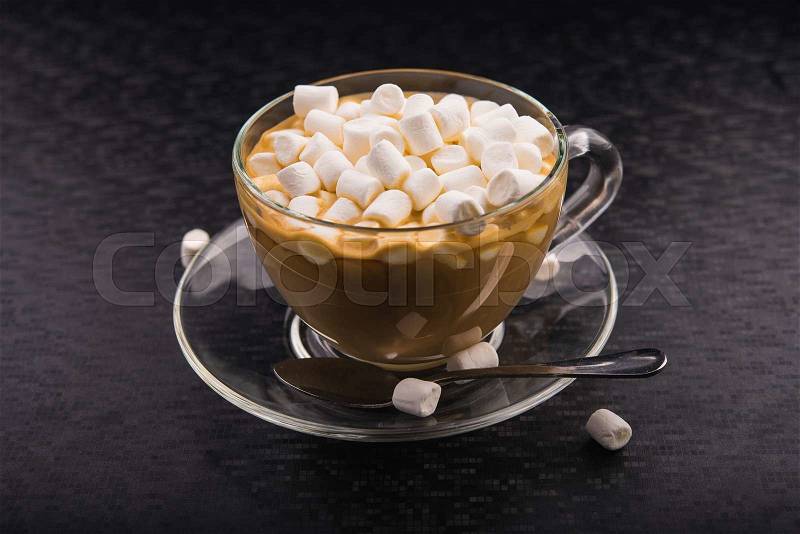 Cup of coffee with tasty marshmallow dessert, stock photo