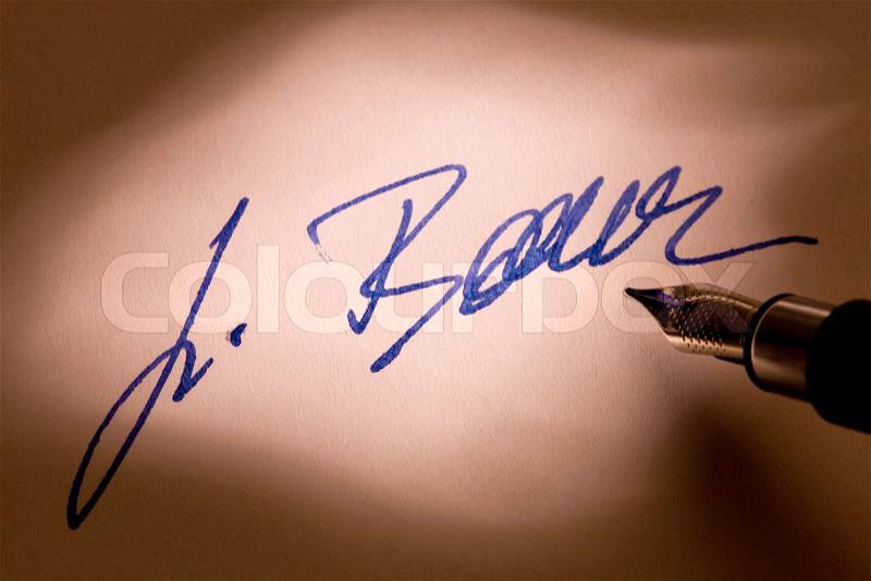 Manual signature with pen in a letter, stock photo
