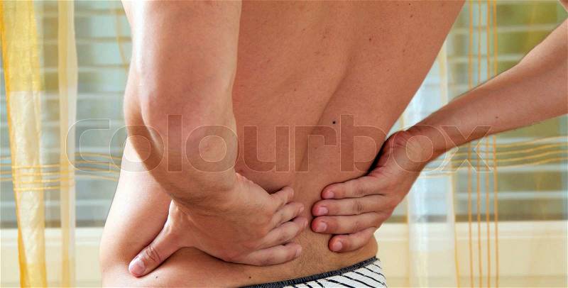 Sickness caused by pain in the back. Intervertebral disc and spinal column, stock photo