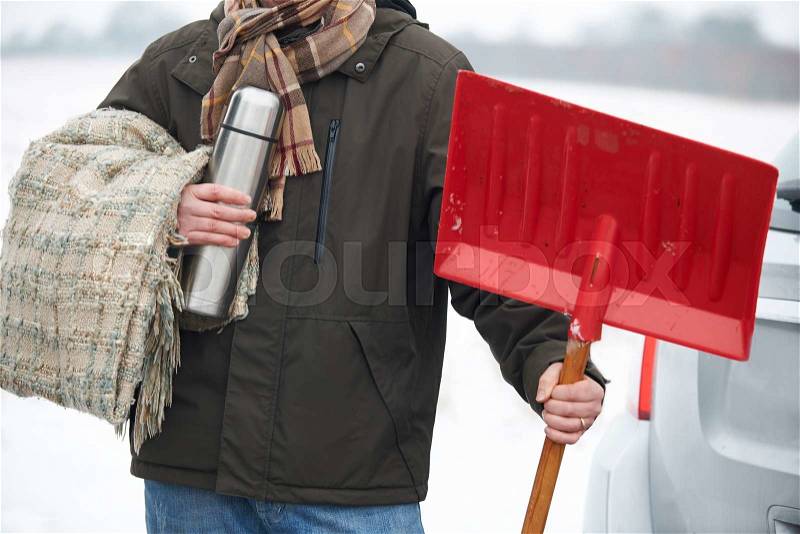 Motorist Holding Blanket And Thermos In Case Of Winter Breakdown, stock photo