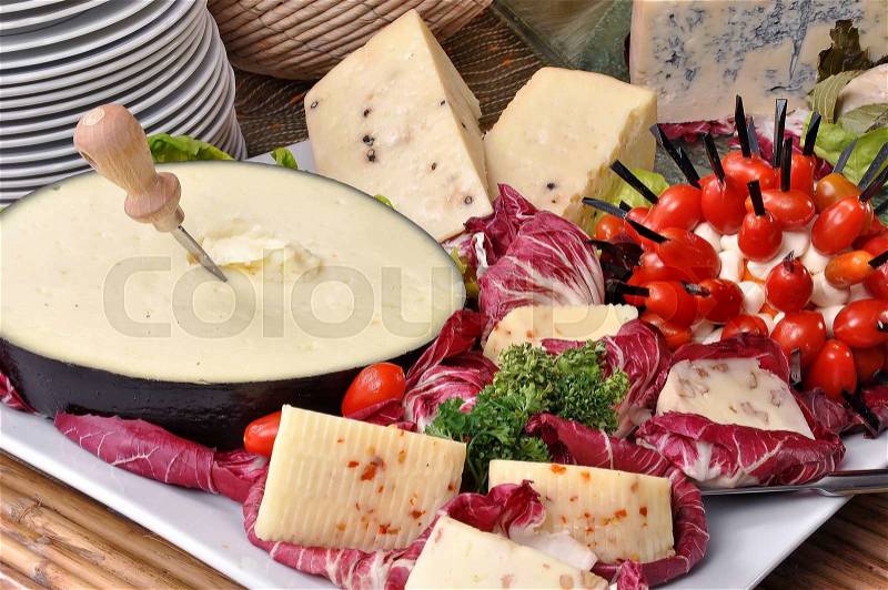 Cheese buffet with fresh tomatos salad and parsley, stock photo