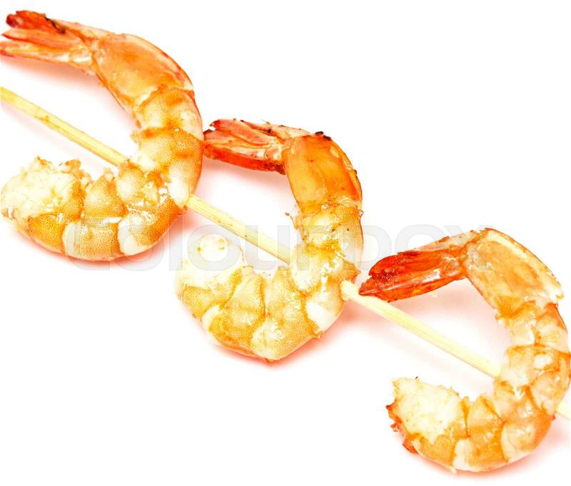 Grilled shrimps on stick isolated on white background, stock photo