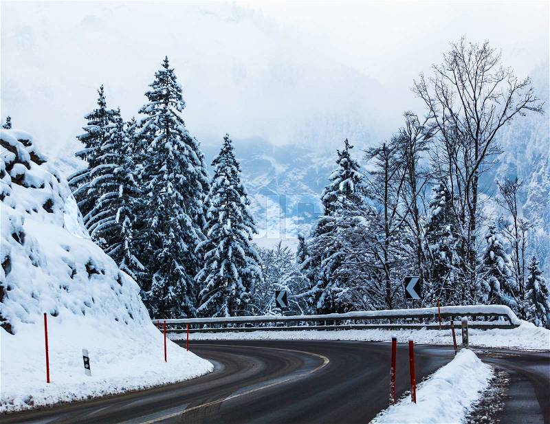 Mountain road in winter. Winter landscape. Winter road and trees covered with snow, stock photo