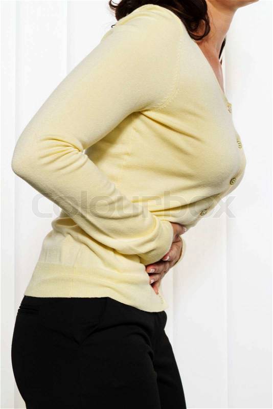 Woman with pain in the abdomen and groin. Menstrual pain, stock photo