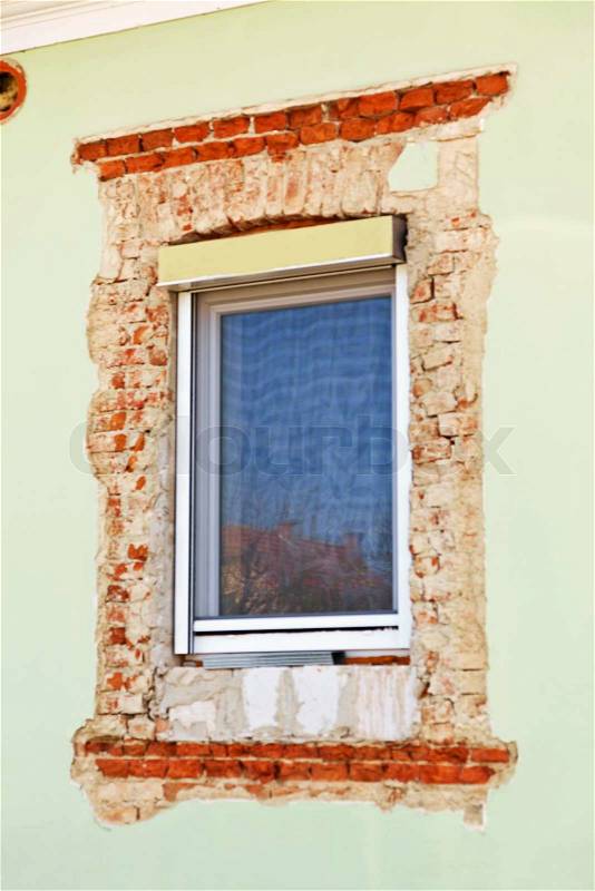 Restauration in an old building. new windows, stock photo