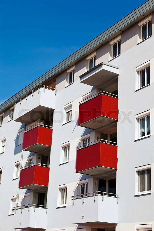 A modern building with balconies. Living in apartments and condos, stock photo