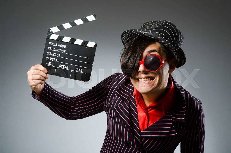 Funny man with movie board, stock photo