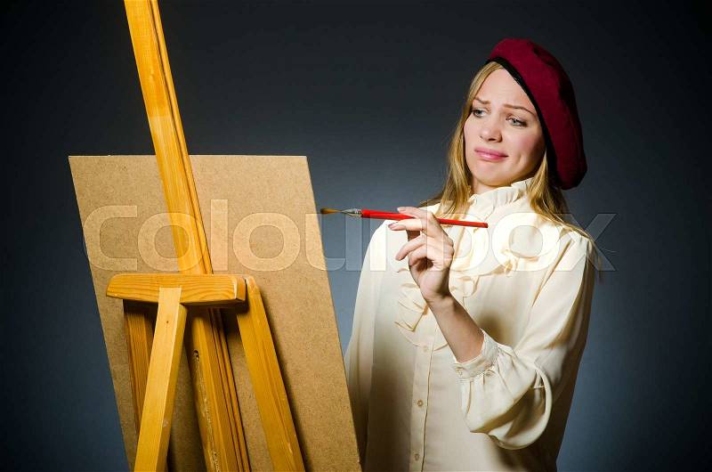 Funny artist working in the studio, stock photo