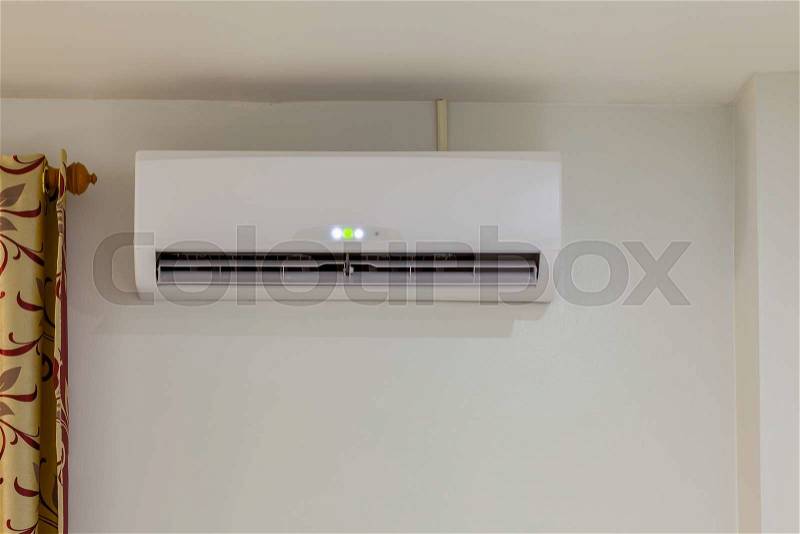 Air conditioner install on wall for condo or meeting room, power on, stock photo