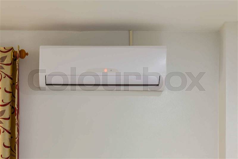 Air conditioner install on wall for condo or meeting room, power off, stock photo