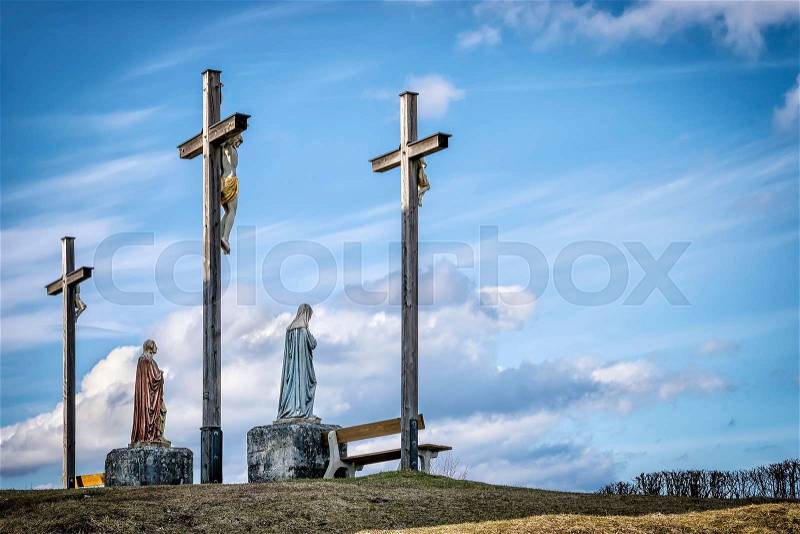 Jesus cross on a hill near Eschenlohe in Bavarian Alps, Germany, stock photo
