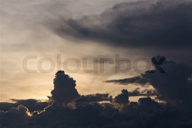 Beautiful sunset sky, dramatic moody sky, black cloudy on yellow light sky background, stock photo