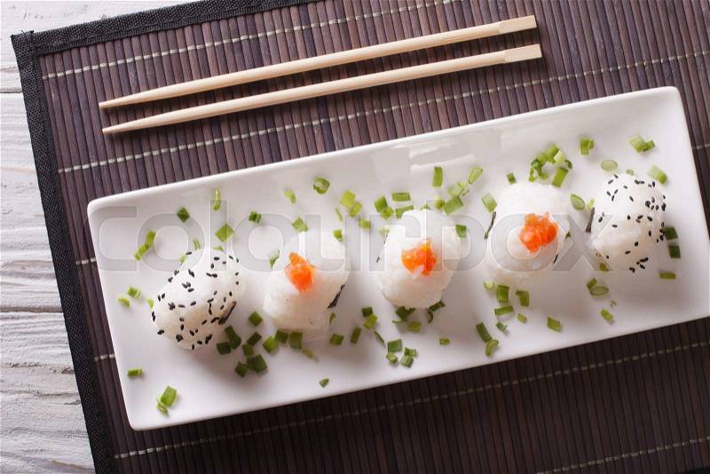 Onigiri rice balls close-up on a white plate. horizontal top view , stock photo