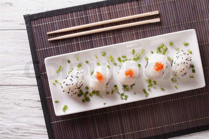 Japanese food onigiri rice balls on a white plate. horizontal top view , stock photo