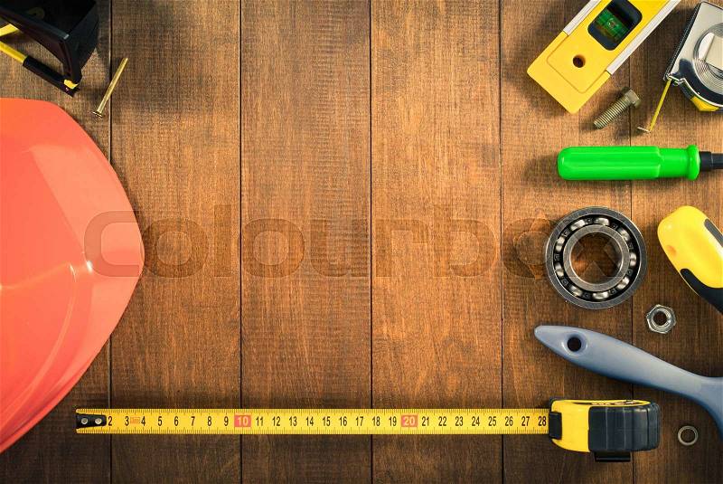 Work tools and instruments on wooden background, stock photo