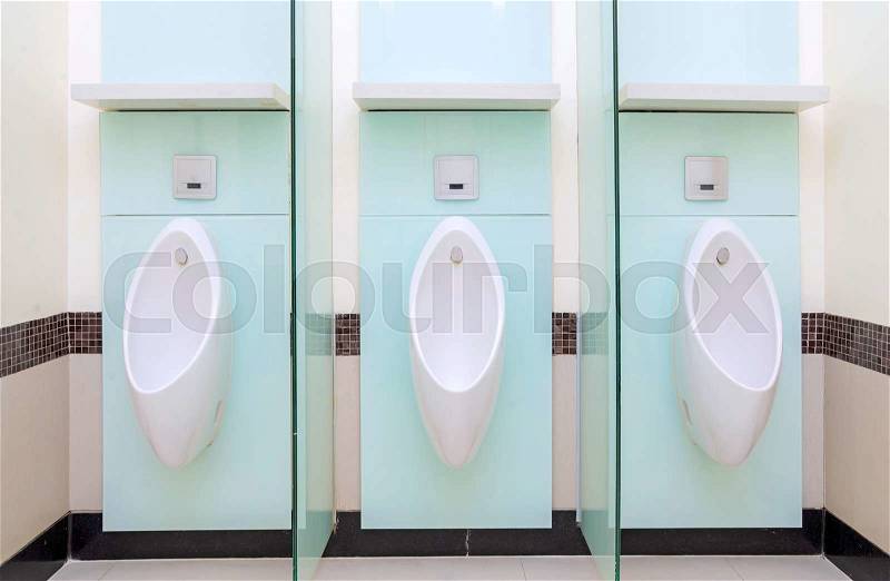 Urinals Men public in toilet room, wc, stock photo