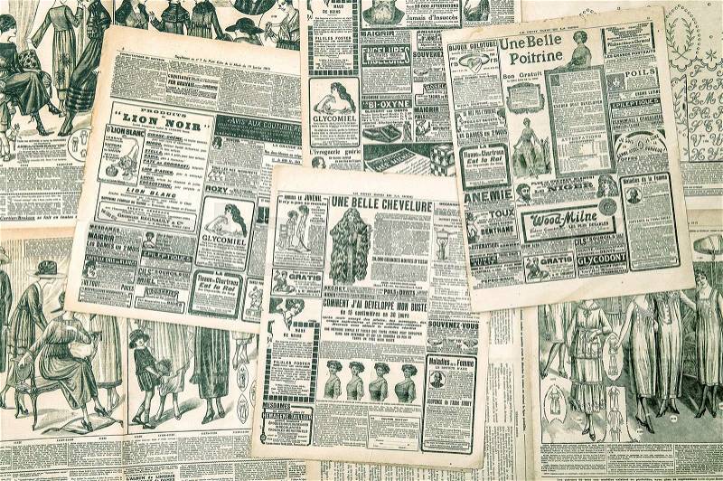 Newspaper pages with antique advertising. Womans fashion magazine. Vintage style toned picture, stock photo