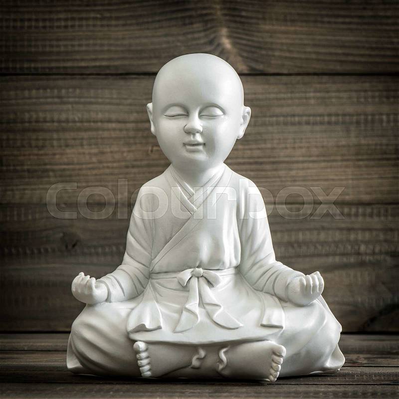 Sitting buddha. Meditation and relaxing concept. Vintage style toned picture, stock photo