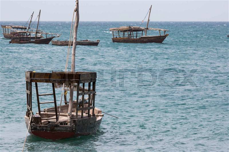 Boats in the Indian Ocean in the Zanzibar archipelago. Formerly a protectorate of the Sultanate of Oman, Zanzibar is now a semi-autonomous region of Tanzania, stock photo